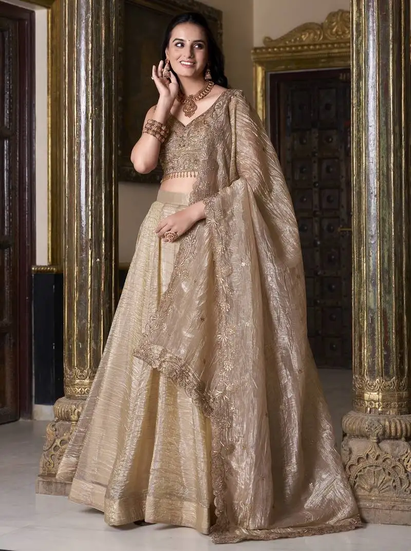 Beige sequins and thread embroidered gold rush fabric indian designer latest design wedding lehenga dress