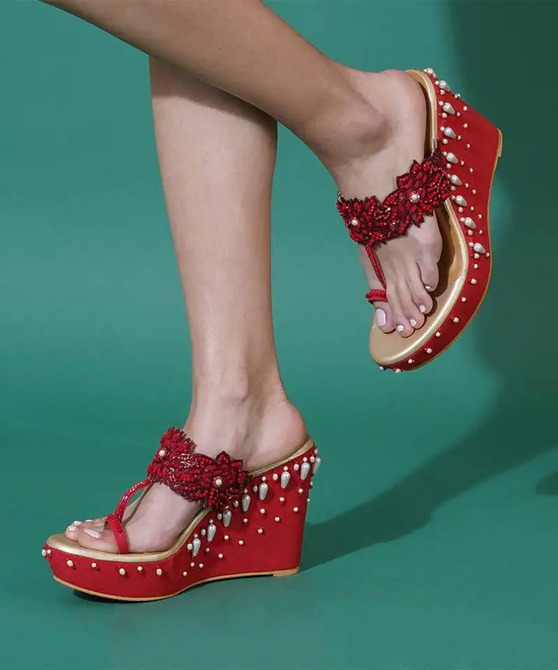Red embroidered wedges shoes