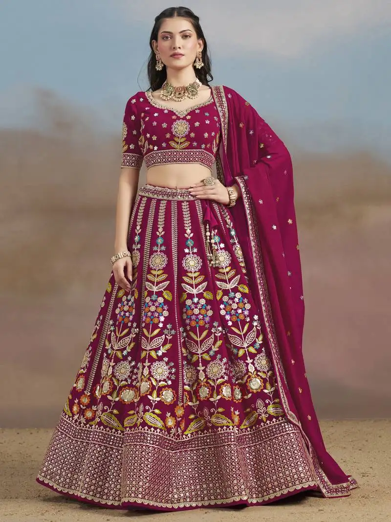 Delightful pink sequins, zari, dori and multi color thread embroidered georgette wedding designer indian lehenga choli