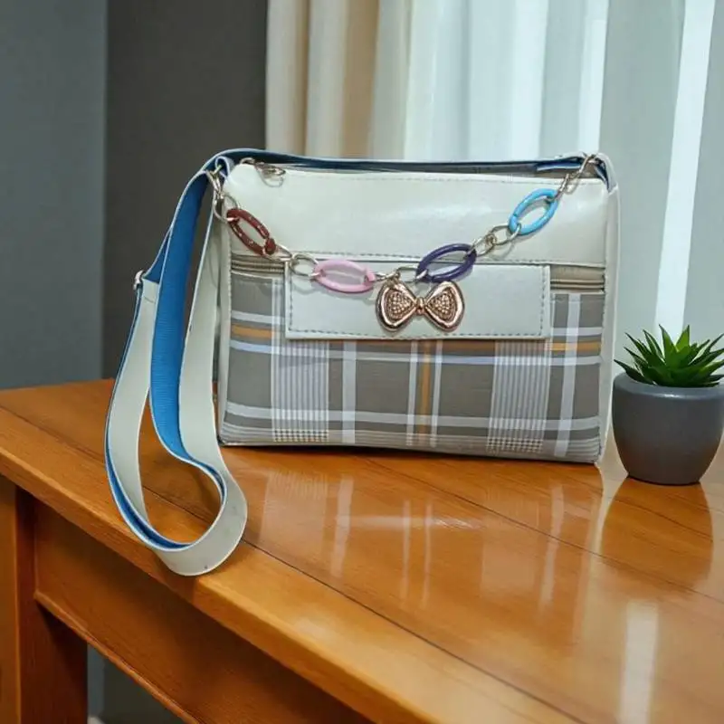 Trendy checkered sling bag with bow charm & multicolor chain | stylish women’s crossbody bag