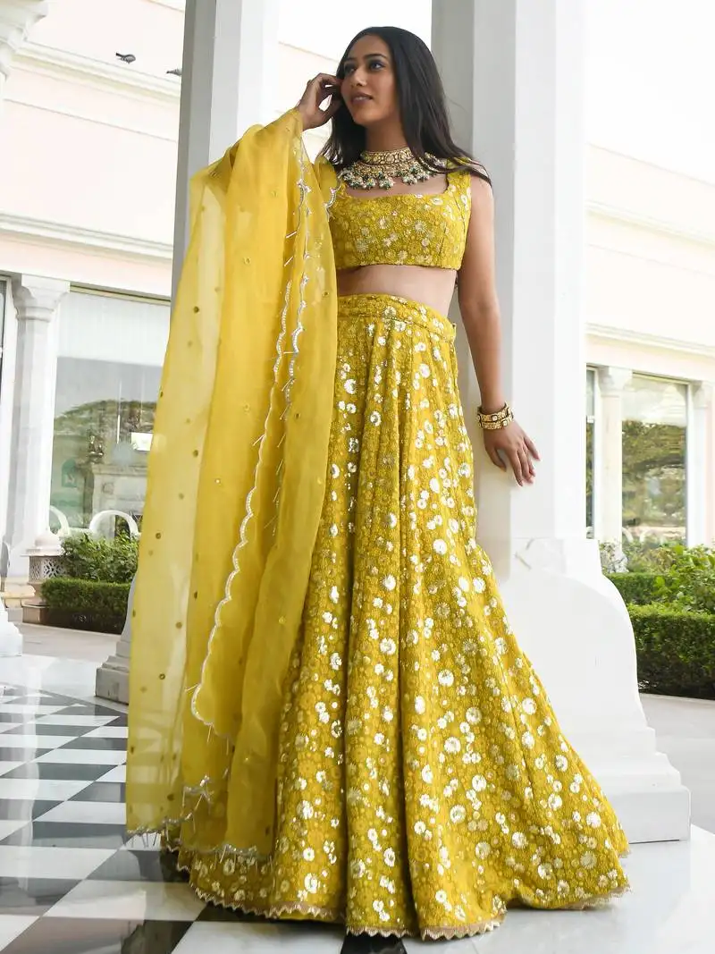 Yellow thread embroidered georgette wedding lehenga choli