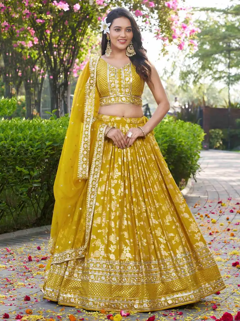 Yellow thread embroidery sangeet wear lehenga choli