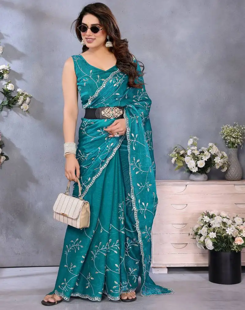 Elegant teal embroidered jimmy chu saree with rich lace work