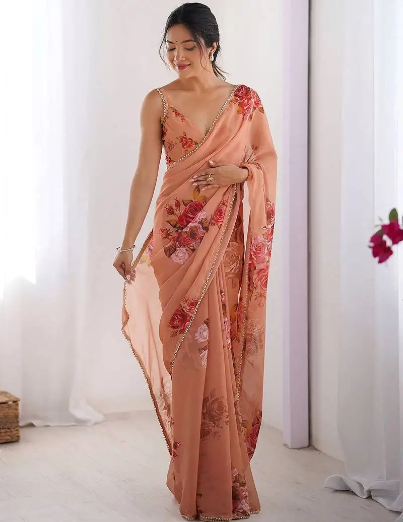 Elegant peach georgette silk printed saree with moti lace border & unstitched blouse