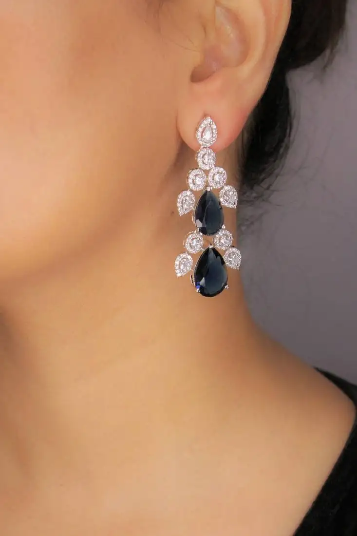 Blue rhodium plated blue synthetic stone zircon studded drop earrings