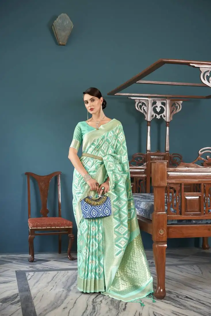 Sea green organza ethnic motifs thread design zari saree with blouse