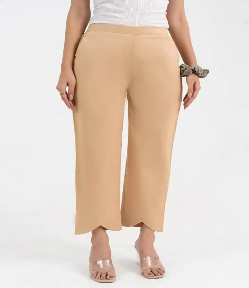 Beige cotton solid pant with leaf bottom