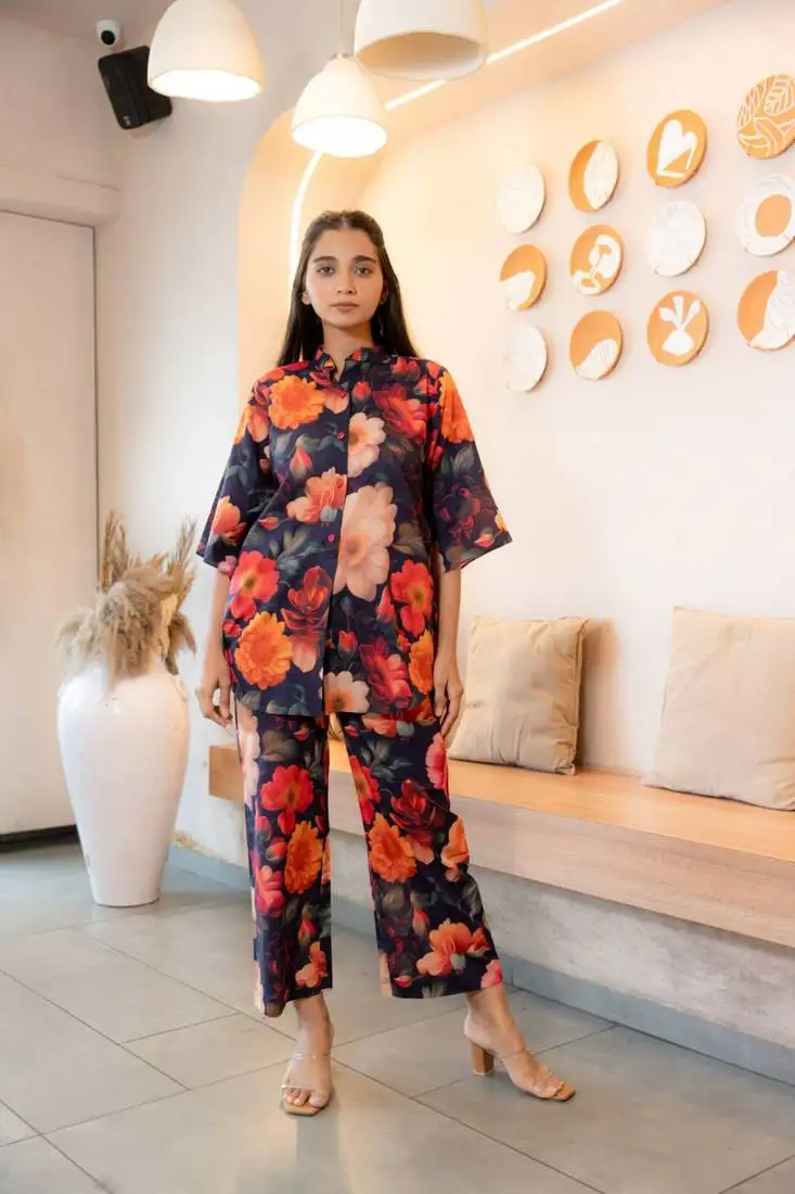 Half buttoned bold floral flared printed cotton top