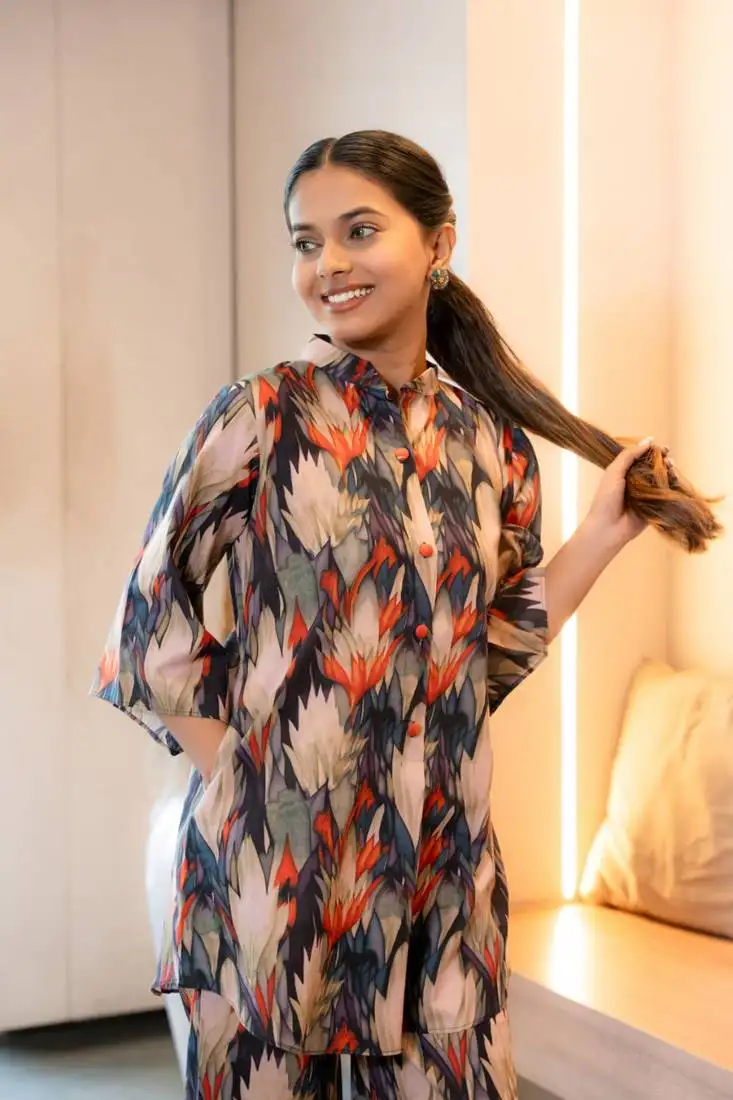 Half buttoned bold flared printed cotton top