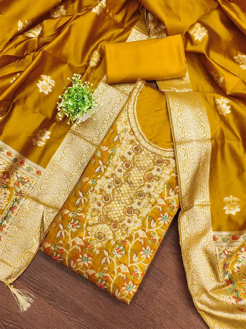 Golden jacquard salwar suit with heavy embroidery and rich dupatta unstitched