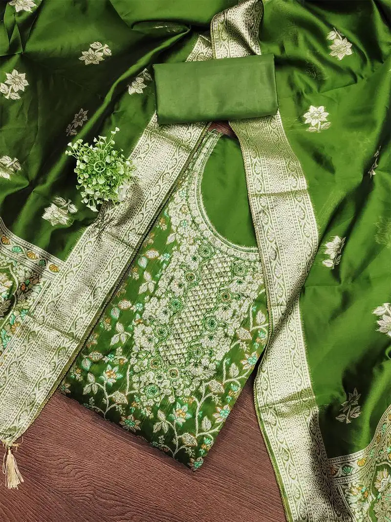 Green jacquard salwar suit with heavy embroidery and rich dupatta unstitched