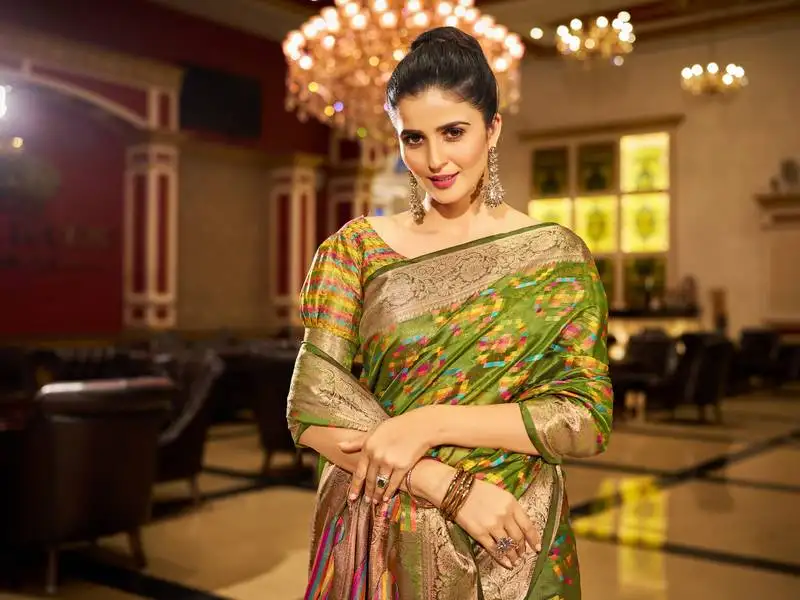 Mahendi green organza silk blend zari border festive wear saree with blouse piece