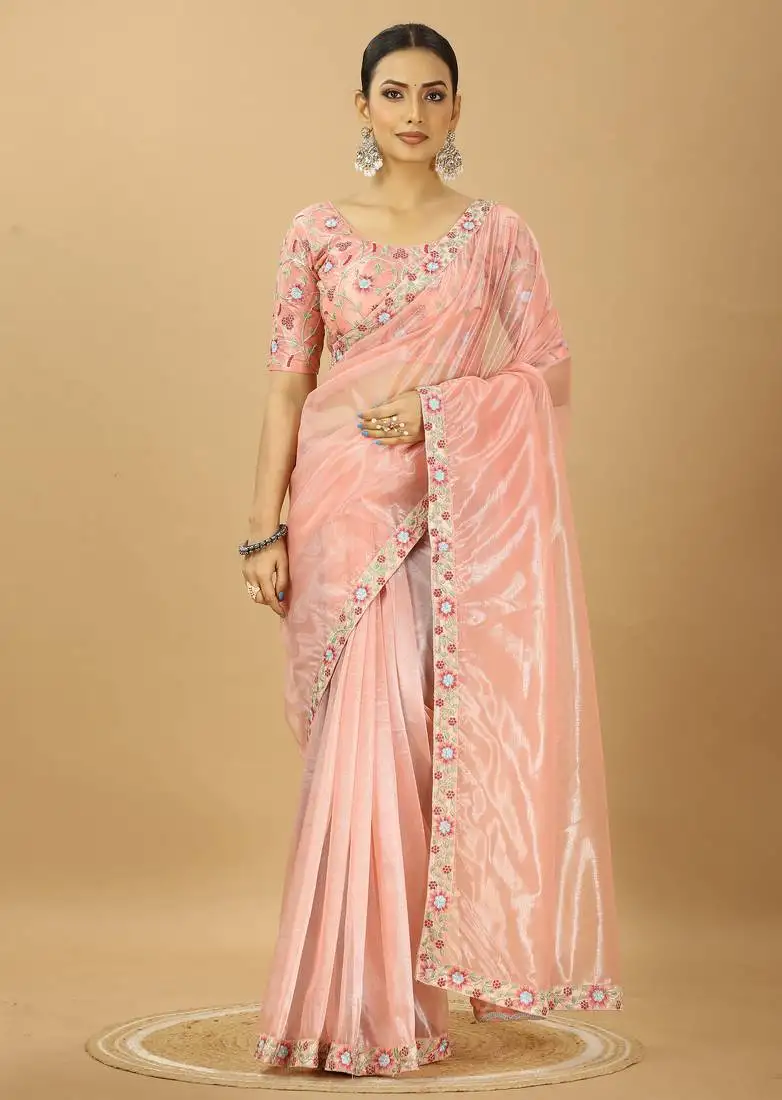 Peach twill net saree with embroidery less and blouse