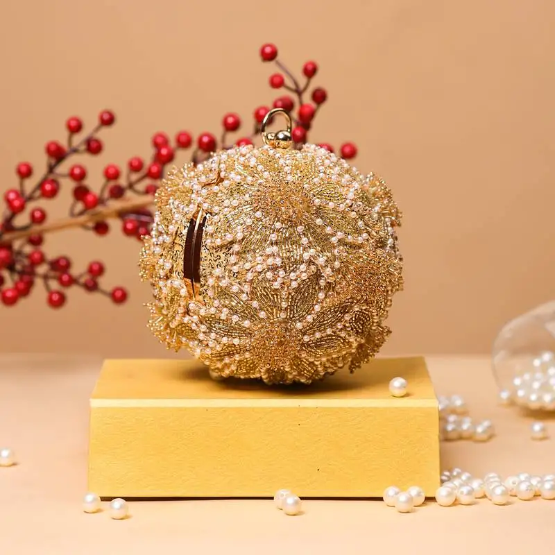 Emma round clutch bag with sling