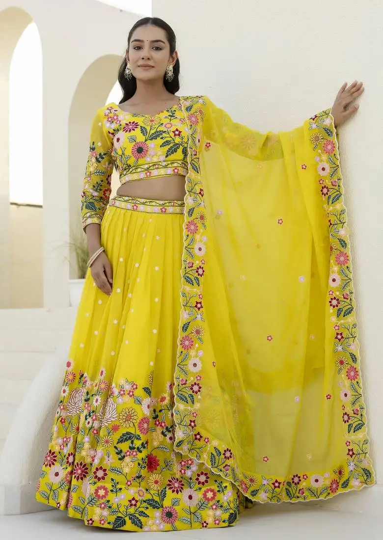 Yellow thread and sequins embroidered organza lehenga dress