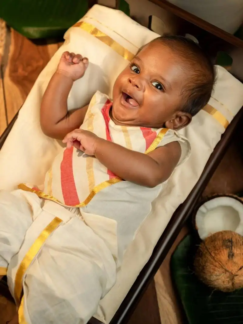 White sleeveless infant handloom kurta, dhoti pant and shoes set for kids