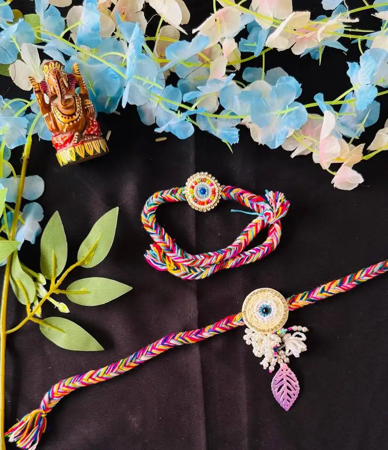 Vibrant multicolor thread bhaiya bhabhi rakhi set with beads & charm accents