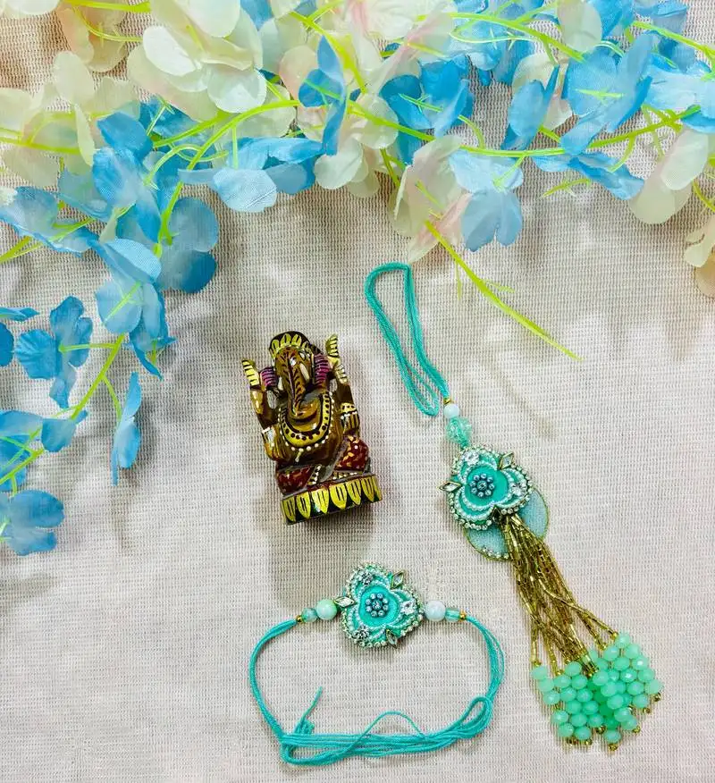 Mint green floral bhaiya bhabhi rakhi set with bead tassels & kundan accents