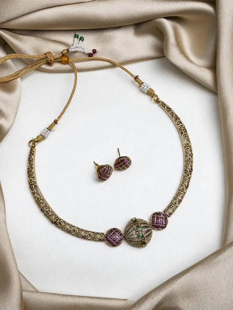 ruby green ad filgree hasli set with small studs