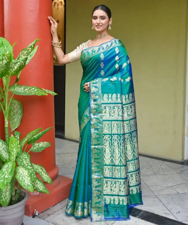 Green dual toned pure handwoven baluchari silk saree with exquisite resham work in copper color