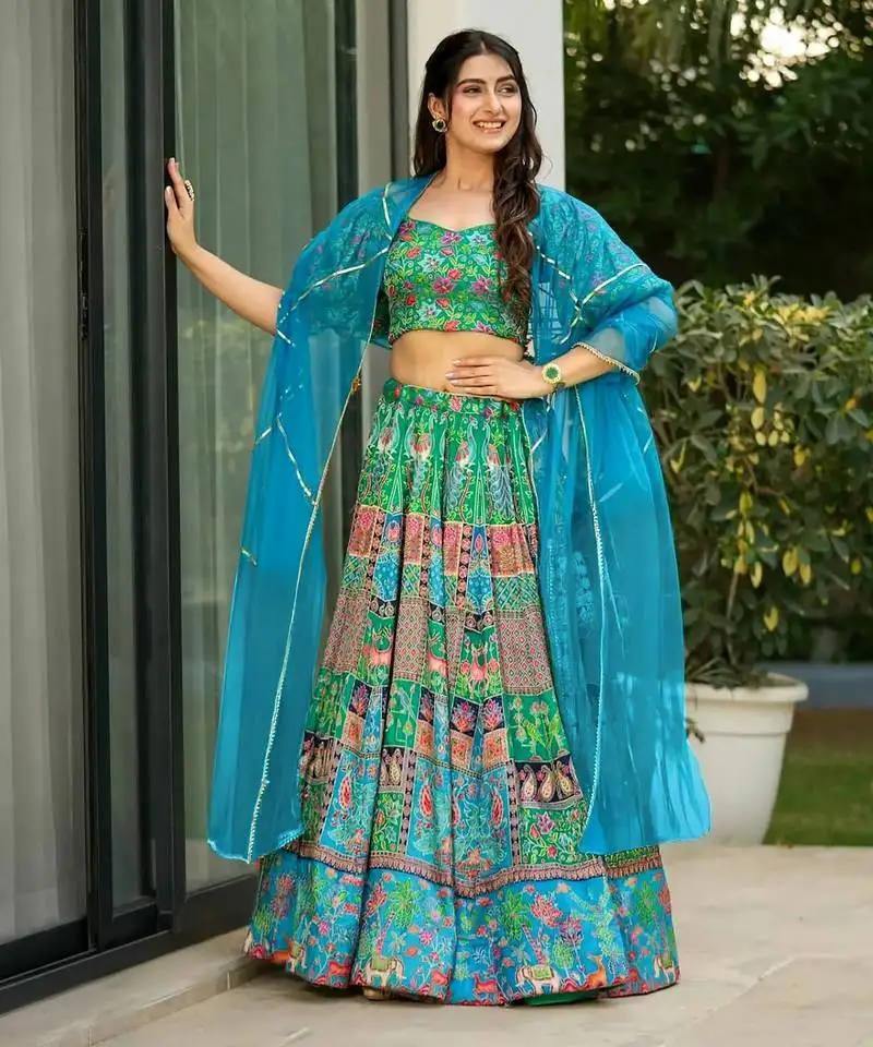 Sea green color ethnic and graceful ceremonial wear designer printed lehenga