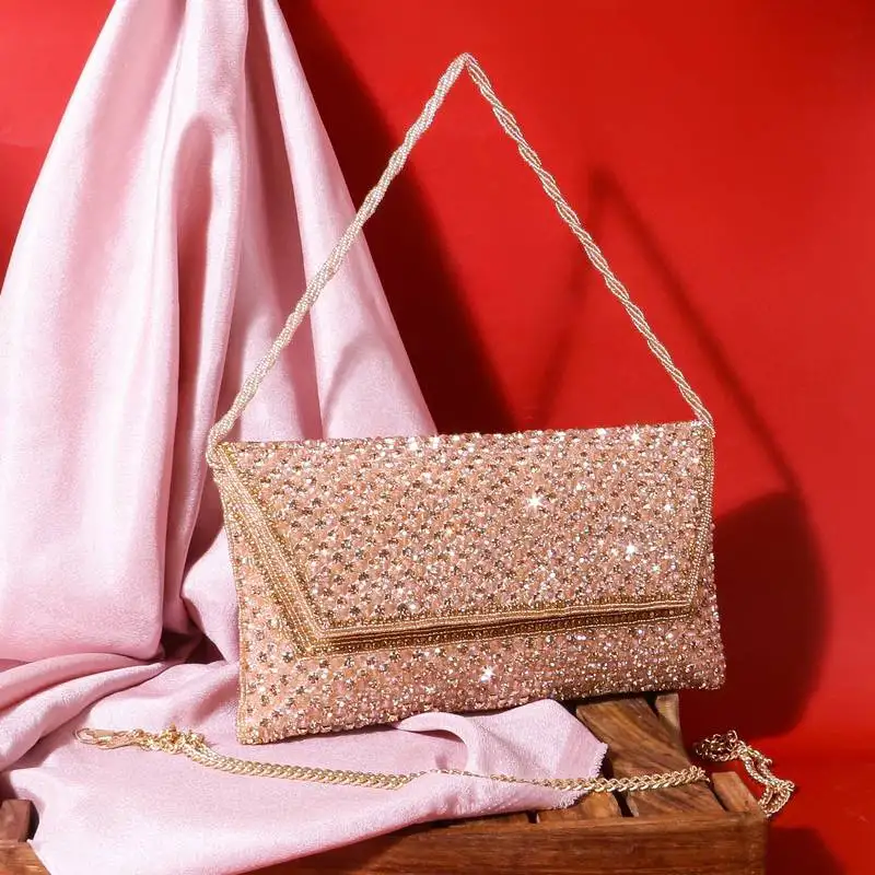 Osty sitara – premium hand-zari embellished bridal clutch with beaded handle & gold chain-gold