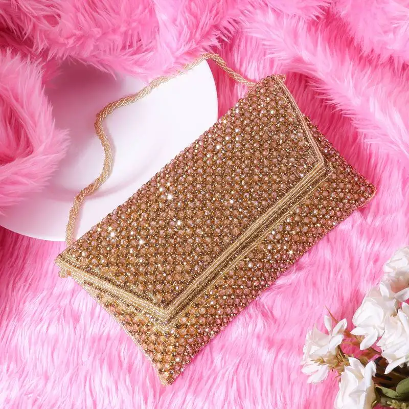 Osty sitara – premium hand-zari embellished bridal clutch with beaded handle & gold chain-beige