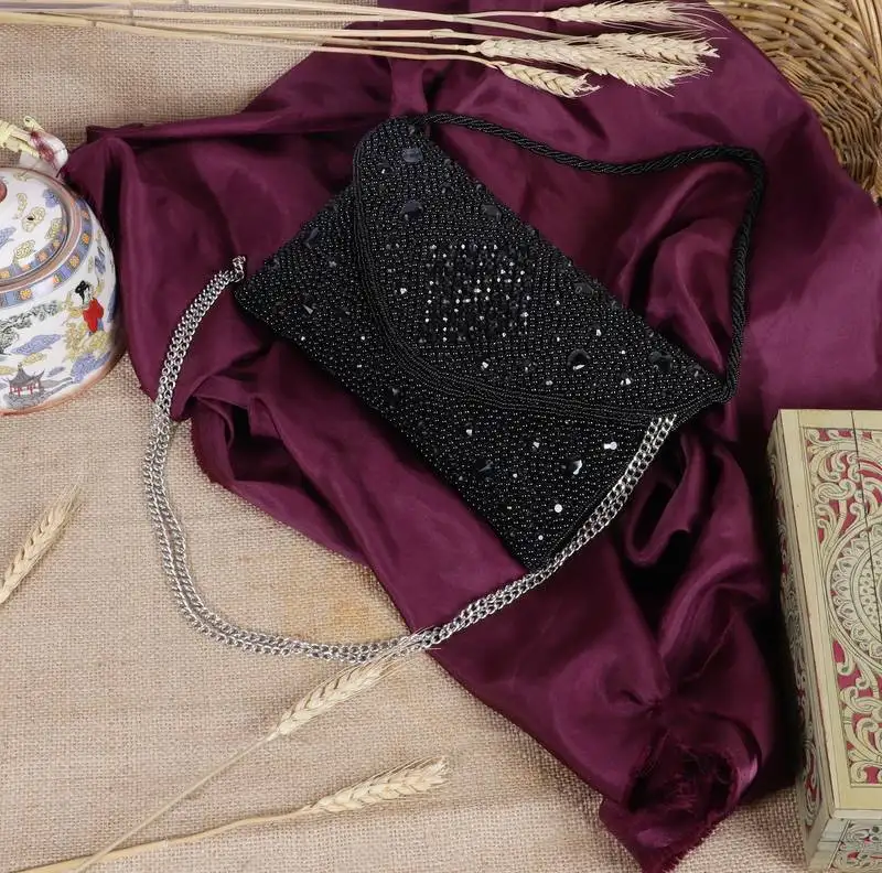 Osty aurelia – handcrafted diamond zari clutch with dual handle-black