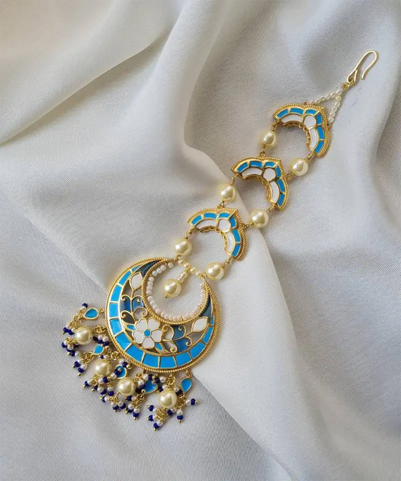 Gold plated blue stone mangtikka in sterling silver