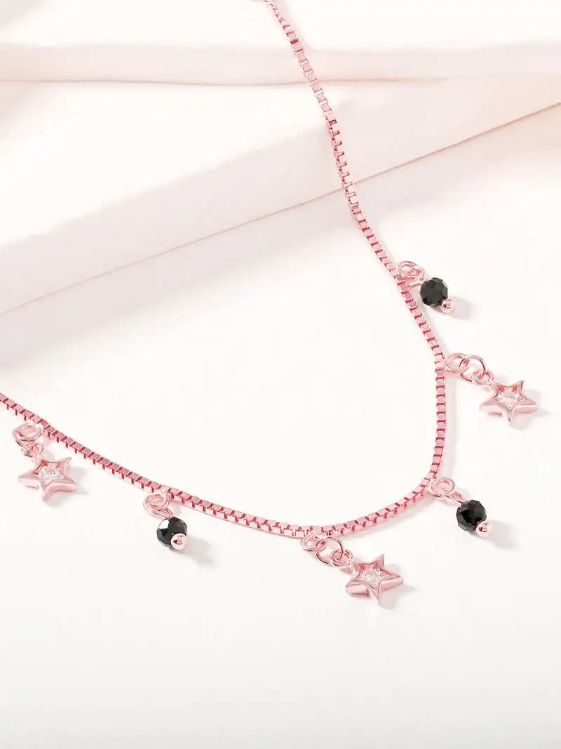 Star charm bracelet with black beads