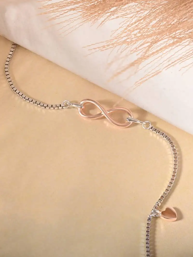 Infinity charm bracelet with heart drop