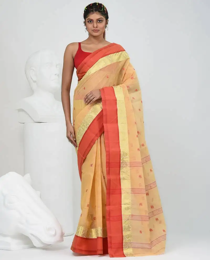 Stylish beige tant saree with red and gold border