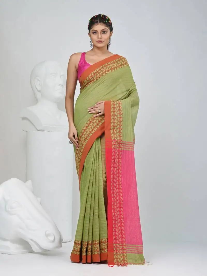 Green and pink handspun cotton saree with vibrant borders