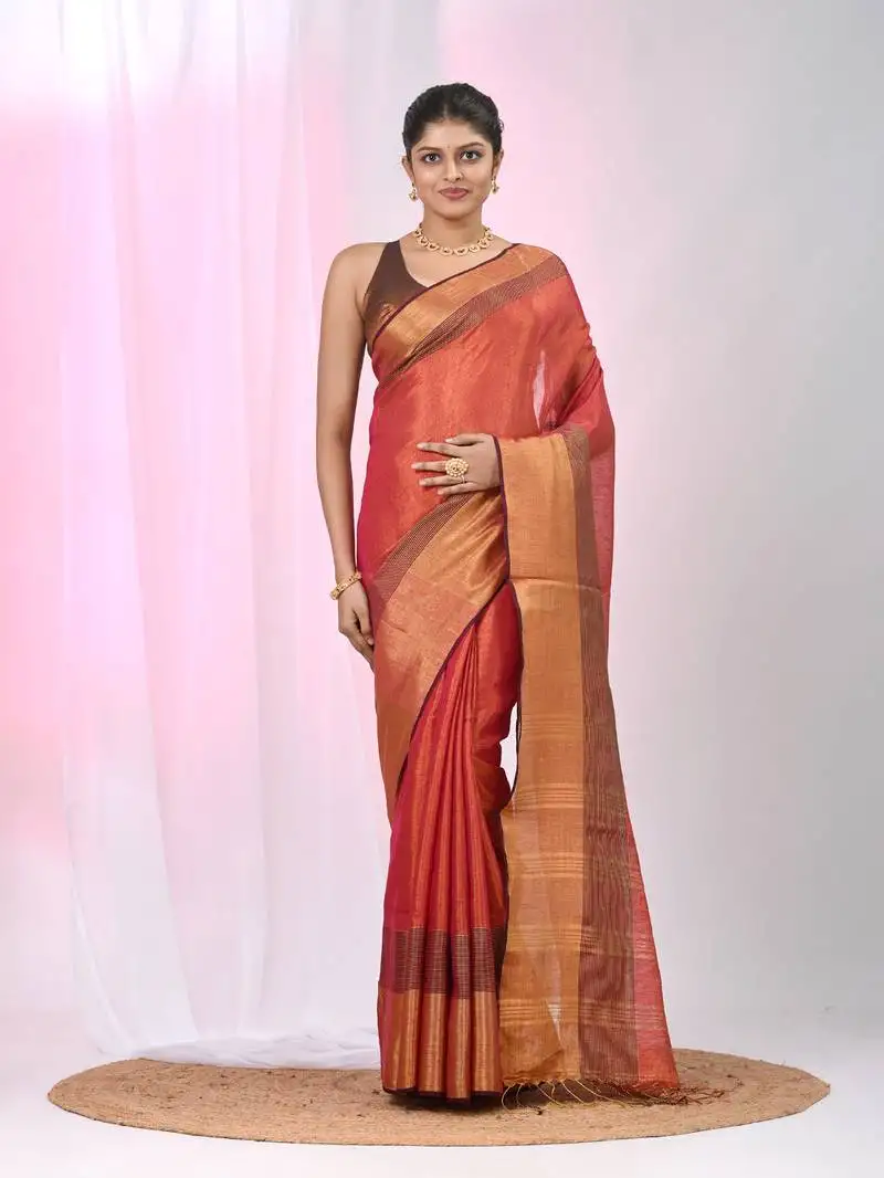 Elegant red tissue saree with contrasting golden border