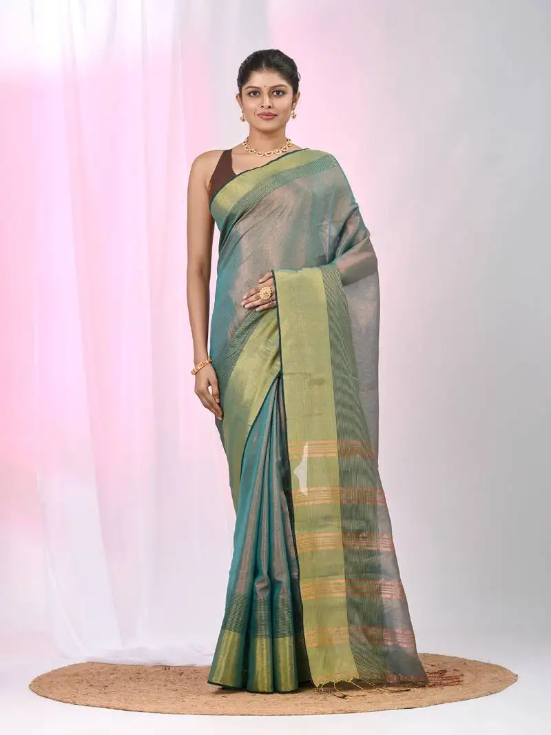Elegant teal tissue saree with contrasting golden border