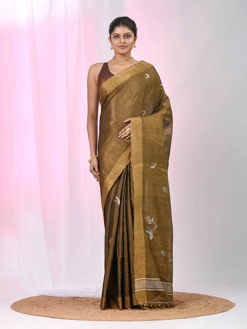 Metallic tissue saree with ethnic motifs and golden border