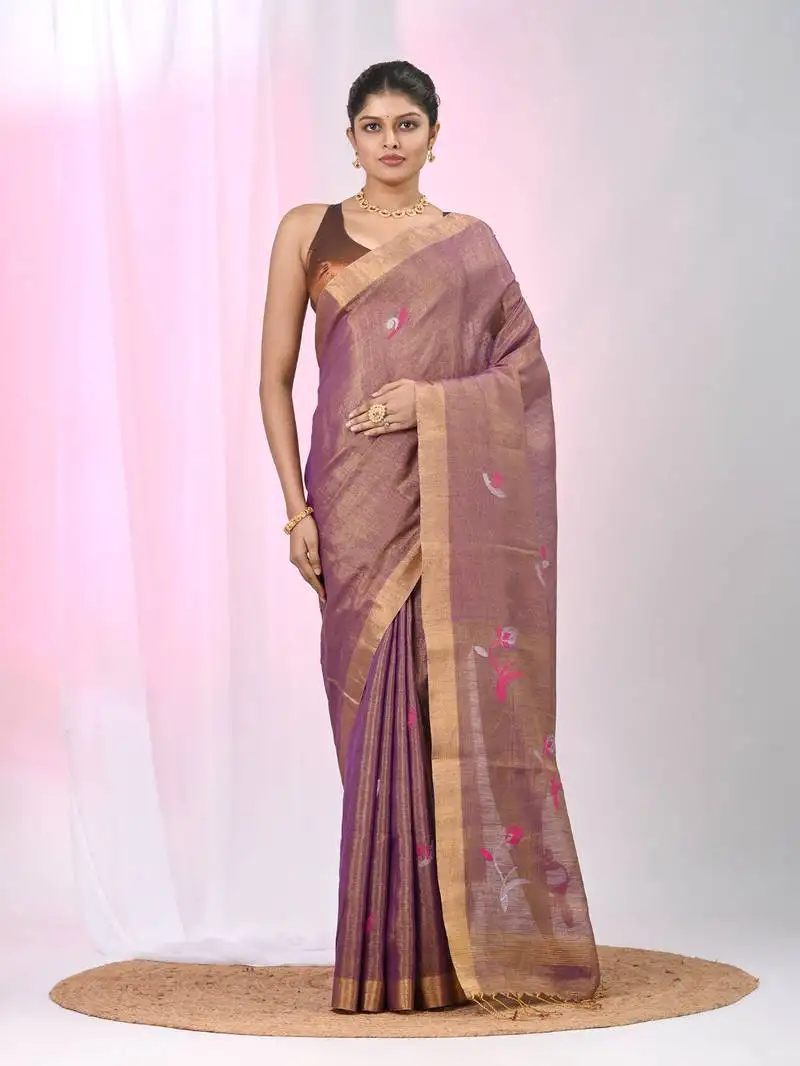 Purple tissue saree with ethnic motifs and golden border