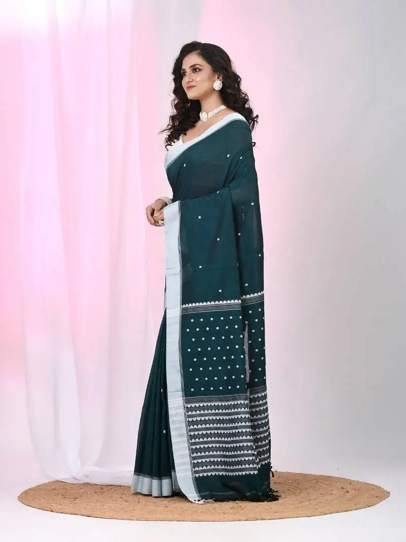 Teal cotton saree with white border and woven patterns