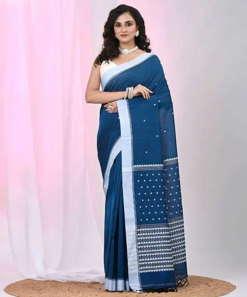 Sapphire blue cotton saree with white border and woven patterns