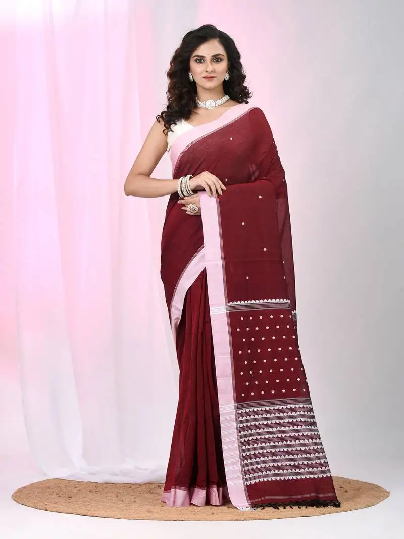 Red cotton saree with white border and woven patterns