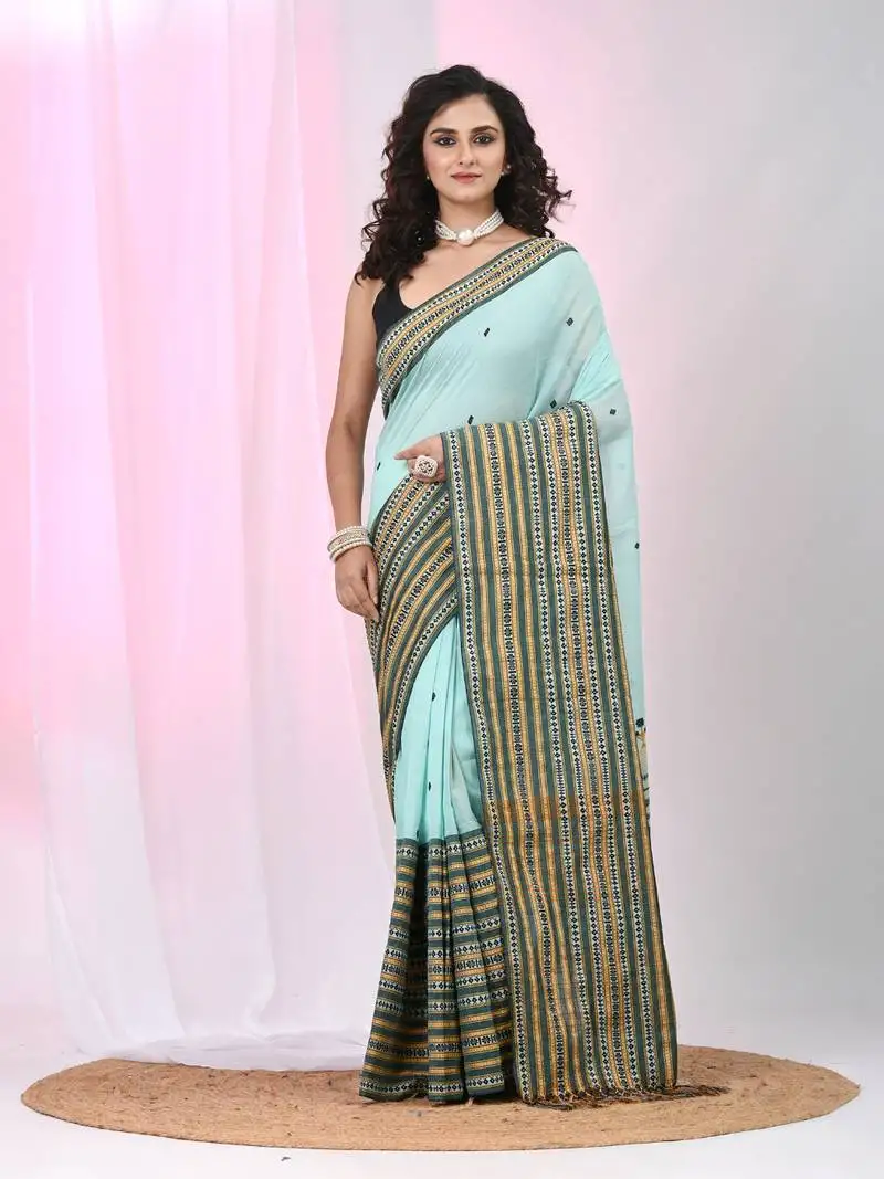 Sea green cotton saree with intricate striped border and tassels