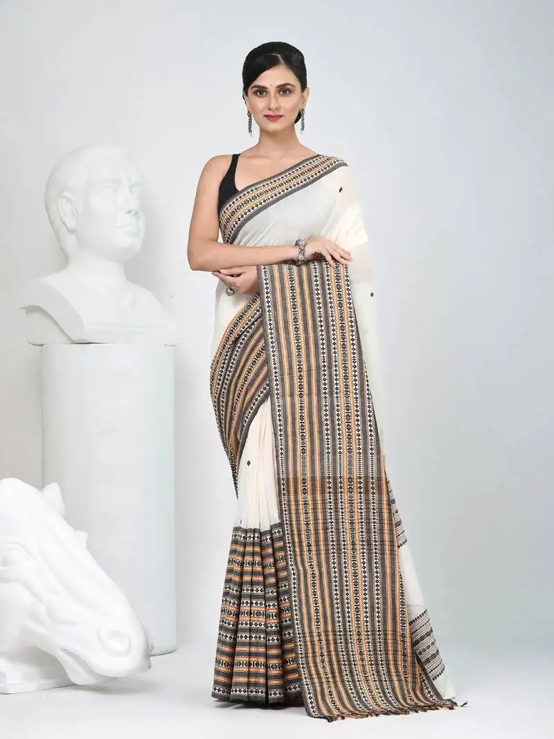 Off white cotton saree with intricate striped border and tassels