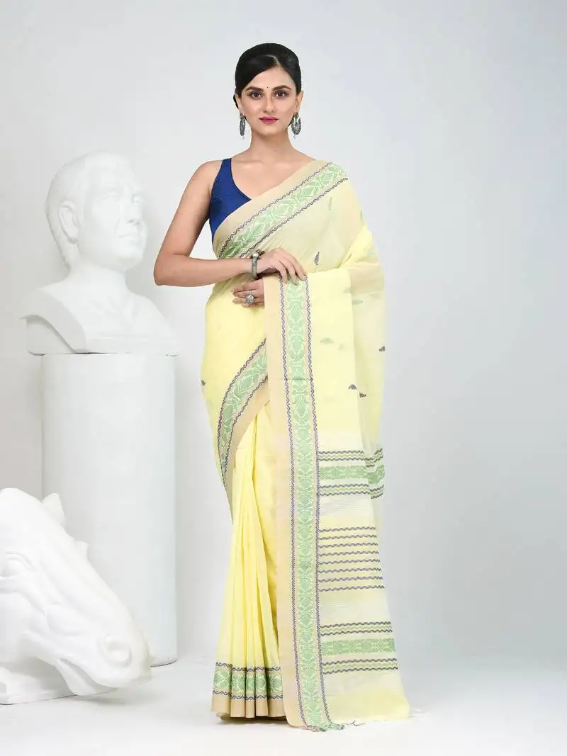 Elegant yellow cotton saree with intricate border design