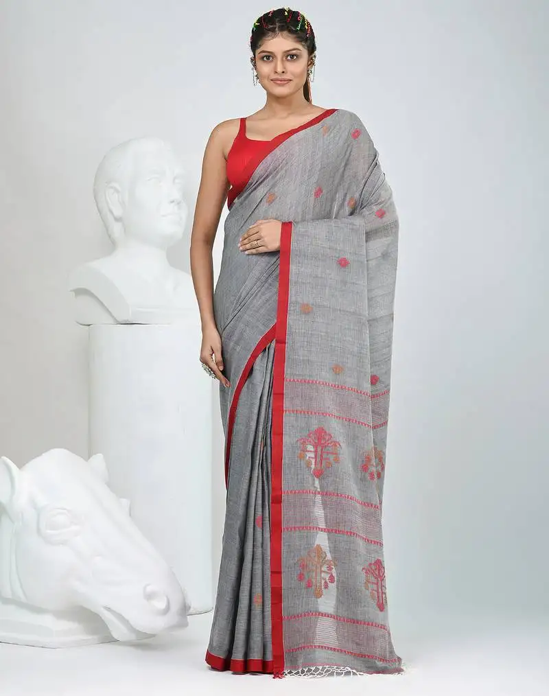 Grey handwoven cotton saree with red border and traditional motifs