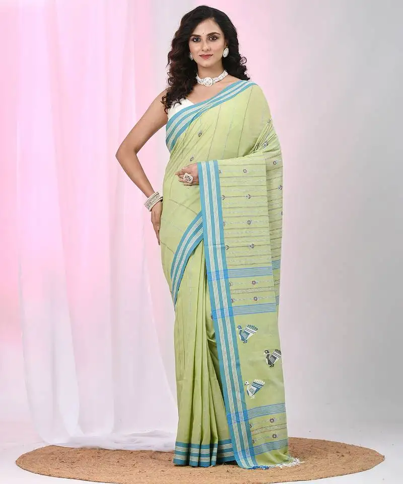 Light green cotton saree with bird motifs and blue stripes