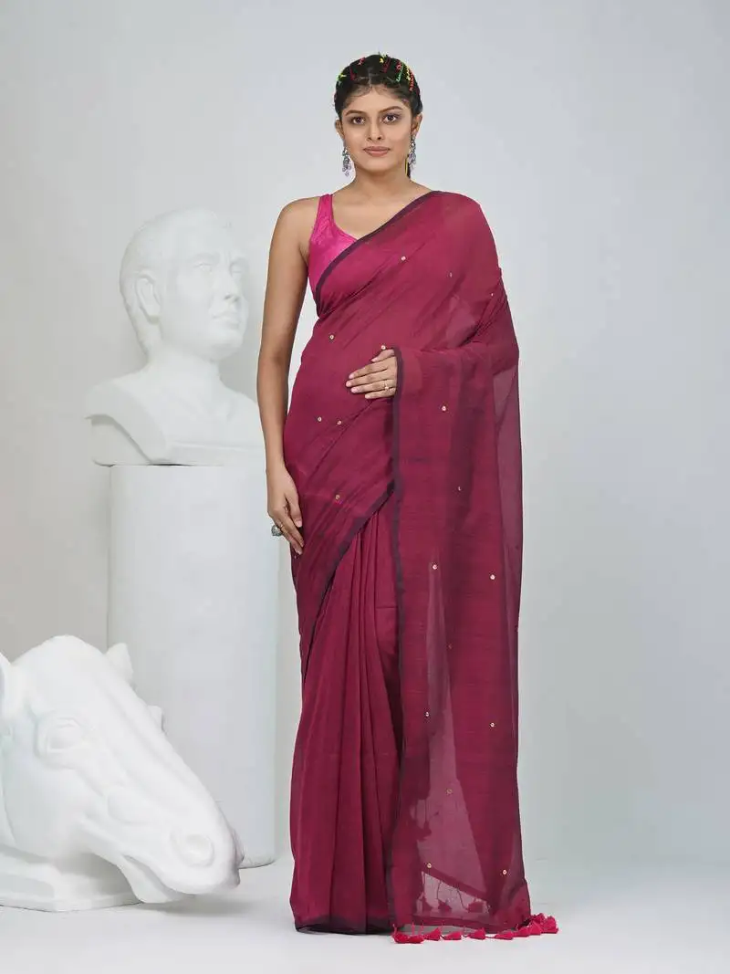 Elegant magenta cotton saree with sequin embellishments and pom pom