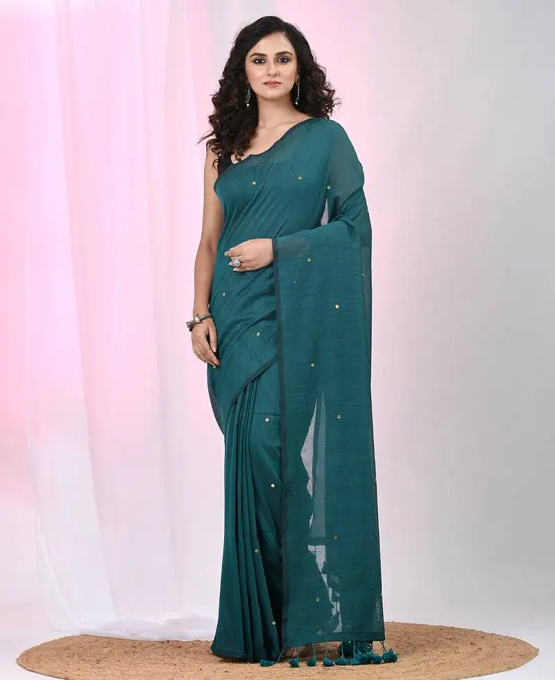Elegant teal cotton saree with sequin embellishments and pom pom
