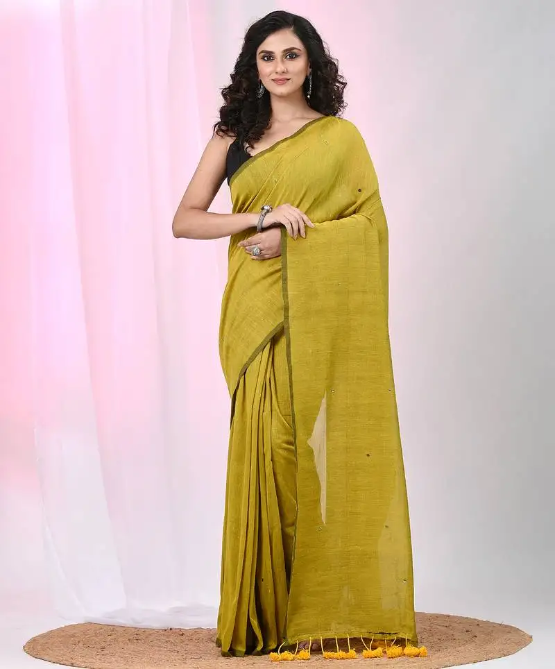 Elegant corn yellow cotton saree with sequin embellishments and pom pom