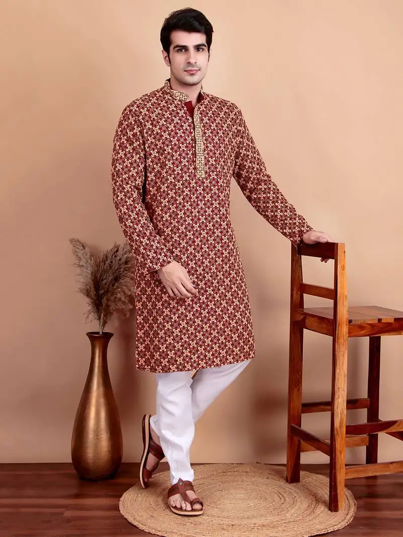 Elegant maroon kurta pyjama set with yellow thread embroidered geometric pattern & embellished neckline