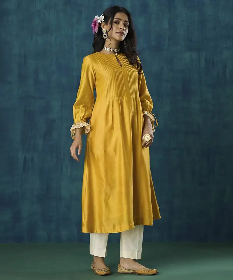 Yellow plain flowy chanderi kurti with handmade tassels
